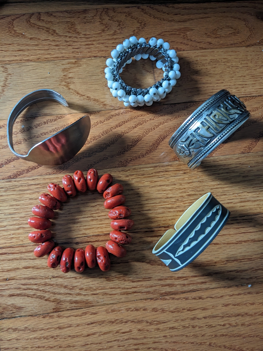 Mixed Bracelet Lot — Red Beaded, White Stretch, Silver Cuffs